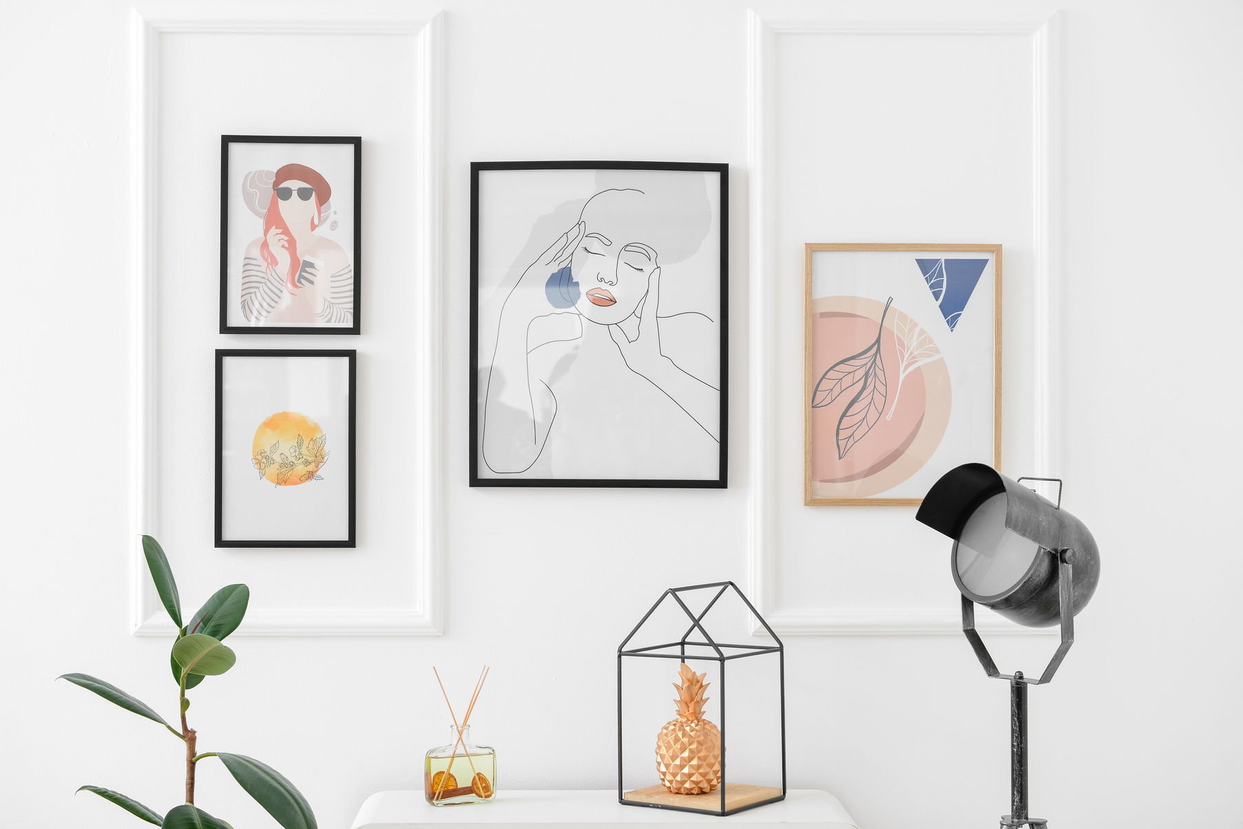 Stylish Pictures Hanging on Light Wall
